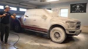 Professional foam wash during car detailing service