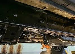 Fresh undercoating applied to a vehicle underbody