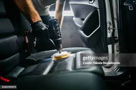 Clean vehicle seats after professional interior detailing