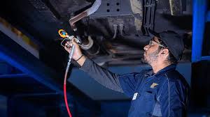 Vehicle underside before rustproofing and undercoating service in Fairfax Virginia